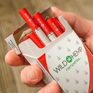 Wild Hemp Sweet flavored CBD cigarette in hand 